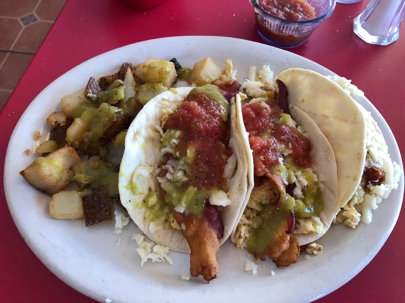 Al Pastor Gordita - Two thick corn tortillas stuffed with marinated al pastor pork, refried beans, pico de gallo, and monterey cheese.