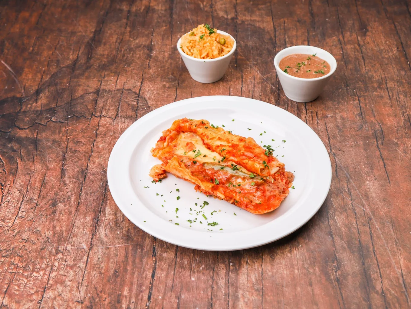 Cheese Enchiladas - Classic Tex-Mex cheese enchiladas smothered in rich chili gravy, topped with melted cheese and onions.